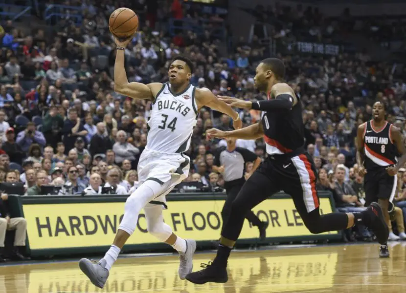 Oct 21, 2017; Milwaukee, WI, USA; Milwaukee Bucks forward Giannis Antetokounmpo (34) drives for the basket against Portland Trail Blazers guard Damian Lillard (0) in the first quarter at BMO Harris Bradley Center. Mandatory Credit: Benny Sieu-USA TODAY Sports