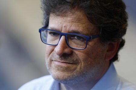 Aug 5, 2022; Milwaukee, Wisconsin, USA; Milwaukee Brewers chairman and principal owner Mark Attanasio answers questions from the media in the dugout prior to the game against the Cincinnati Reds at American Family Field. Mandatory Credit: Jeff Hanisch-USA TODAY Sports