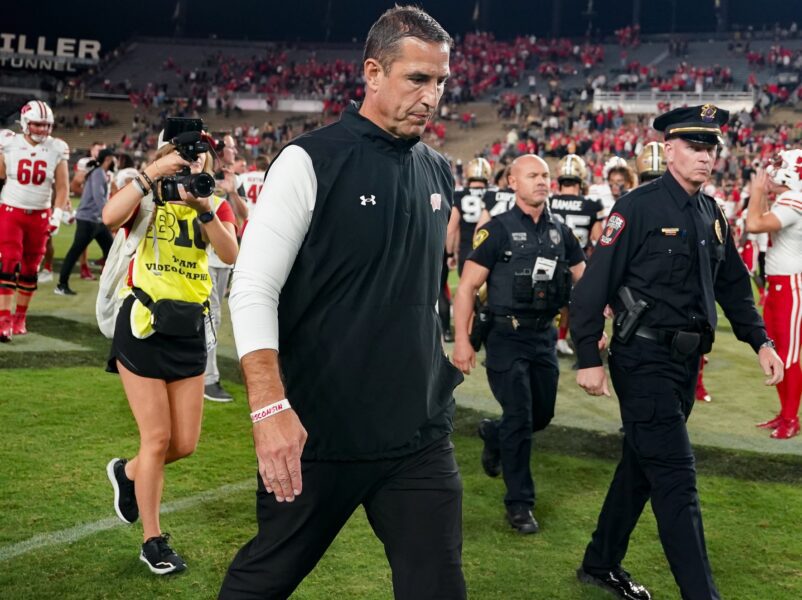 Wisconsin Football Head Coach Luke Fickell walking off the field following Purdue victory.