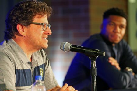 Milwaukee Brewers chairman and principal owner Mark Attanasio, left, talks about Giannis Antetokounmpo, right, becoming an investor in the team at the American Family Field.