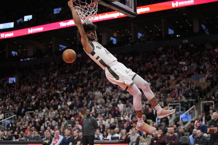 Nov 1, 2023; Toronto, Ontario, CAN; Milwaukee Bucks guard Andre Jackson Jr. (44) hangs off of the rim after dunking against the Toronto Raptors during the second half at Scotiabank Arena. Mandatory Credit: John E. Sokolowski-USA TODAY Sports