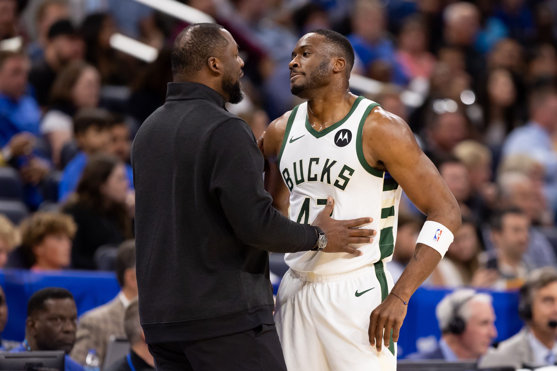 Nov 11, 2023; Orlando, Florida, USA; Milwaukee Bucks head coach Adrian Griffin talks with Milwaukee Bucks forward Thanasis Antetokounmpo (43) during the second half against the Orlando Magic at Amway Center. Mandatory Credit: Matt Pendleton-USA TODAY Sports