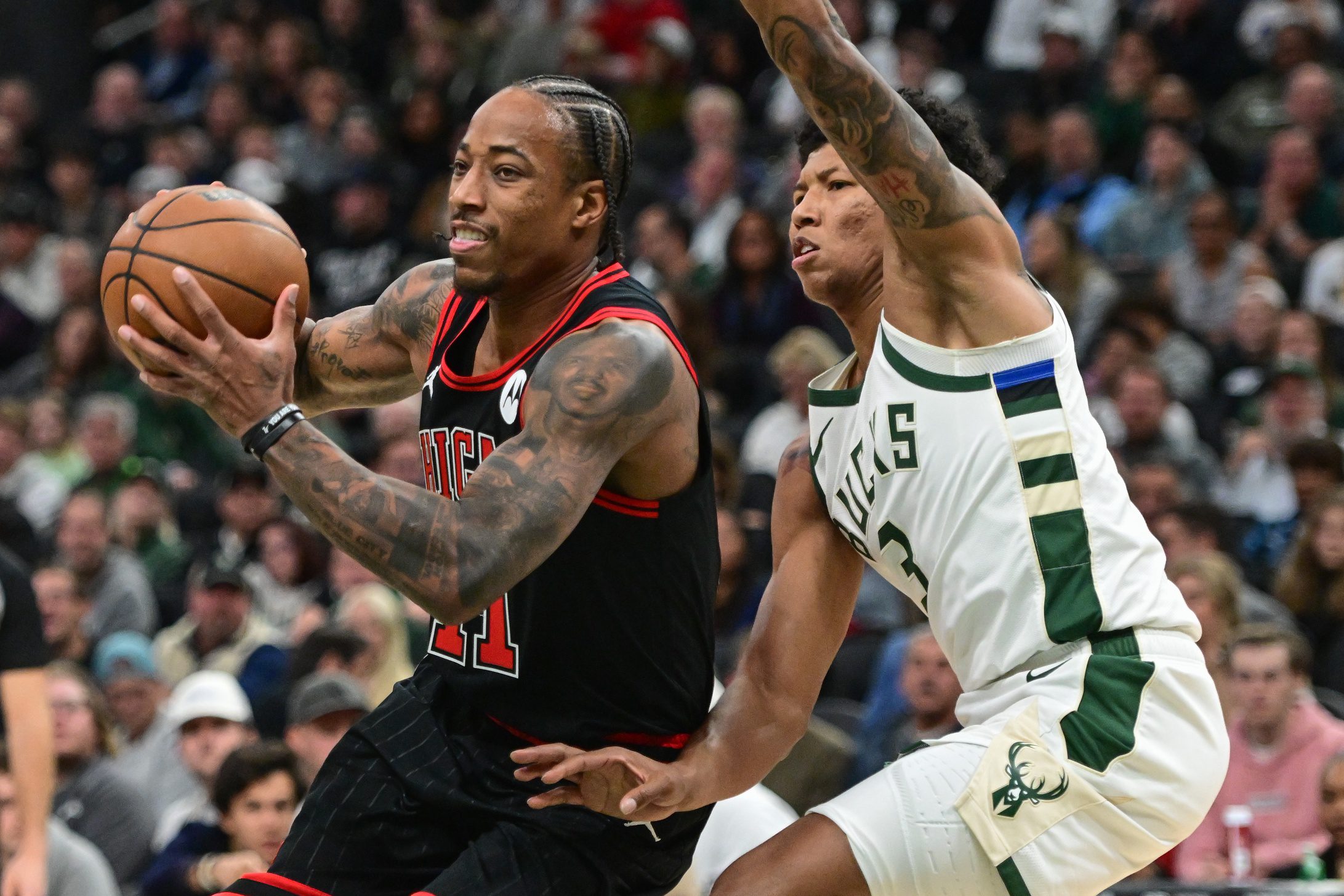 Nov 13, 2023; Milwaukee, Wisconsin, USA; Chicago Bulls guard DeMar DeRozan (11) drives to the basket against Milwaukee Bucks guard MarJon Beauchamp (3) in the second quarter at Fiserv Forum. Mandatory Credit: Benny Sieu-USA TODAY Sports