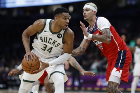 Nov 20, 2023; Washington, District of Columbia, USA; Milwaukee Bucks forward Giannis Antetokounmpo (34) drives to the basket as Washington Wizards forward Kyle Kuzma (33) defends in the fourth quarter at Capital One Arena. Mandatory Credit: Geoff Burke-USA TODAY Sports