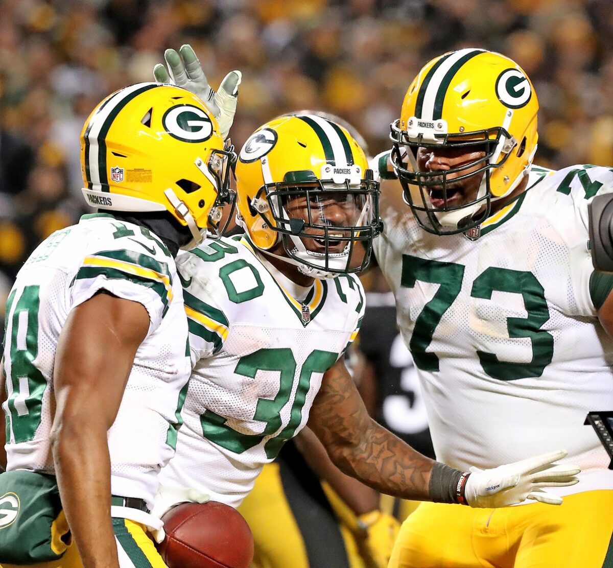 Nov 26, 2017; Pittsburgh, PA, USA; Green Bay Packers running back Jamaal Williams (30) celebrates his fourth quarter touchdown with wide receiver Randall Cobb (18) and offensive guard Jahri Evans (73) against the Pittsburgh Steelers at Heinz Field. Jim Matthews/USA TODAY NETWORK-Wisconsin via USA TODAY NETWORK