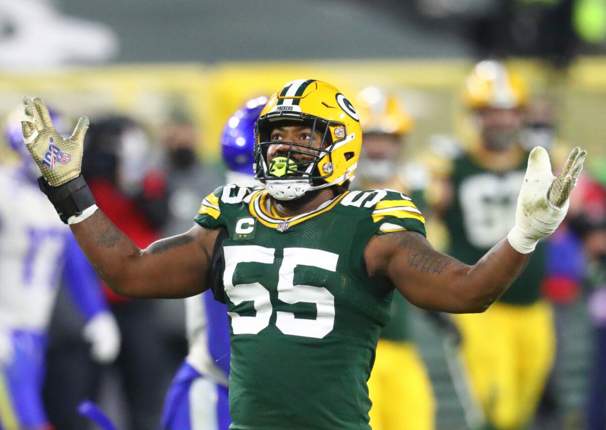 Jan 16, 2021; Green Bay, Wisconsin, USA; Green Bay Packers linebacker Za'Darius Smith (55) celebrates against the Los Angeles Rams during the NFC Divisional Round at Lambeau Field. Mandatory Credit: Mark J. Rebilas-USA TODAY Sports