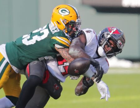 Green Bay Packers cornerback Jaire Alexander (23) breaks up a pass intended for Tampa Bay Buccaneers wide receiver Chris Godwin (14) during the 1st quarter of the Green Bay Packers game against the Tampa Bay Buccaneers in the NFC championship playoff game Sunday, Jan. 24, 2021 at Lambeau Field in Green Bay, Wis. © Mike De Sisti / The Milwaukee Jo via Imagn Content Services, LLC