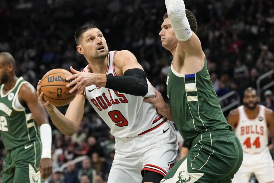 Dec 11, 2023; Milwaukee, Wisconsin, USA; Chicago Bulls center Nikola Vucevic (9) looks to shoot against Milwaukee Bucks center Brook Lopez (11) during the first quarter at Fiserv Forum. Mandatory Credit: Jeff Hanisch-USA TODAY Sports