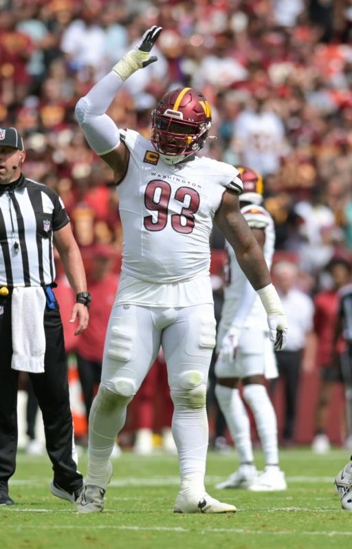 Sep 10, 2023; Landover, Maryland, USA; Washington Commanders defensive tackle Jonathan Allen (93) and defensive end Casey Toohill (95) celebrate after tackling Arizona Cardinals running back Keaontay Ingram (not pictured) behind the line of scrimmage during the first half at FedExField. Mandatory Credit: Tommy Gilligan-USA TODAY Sports