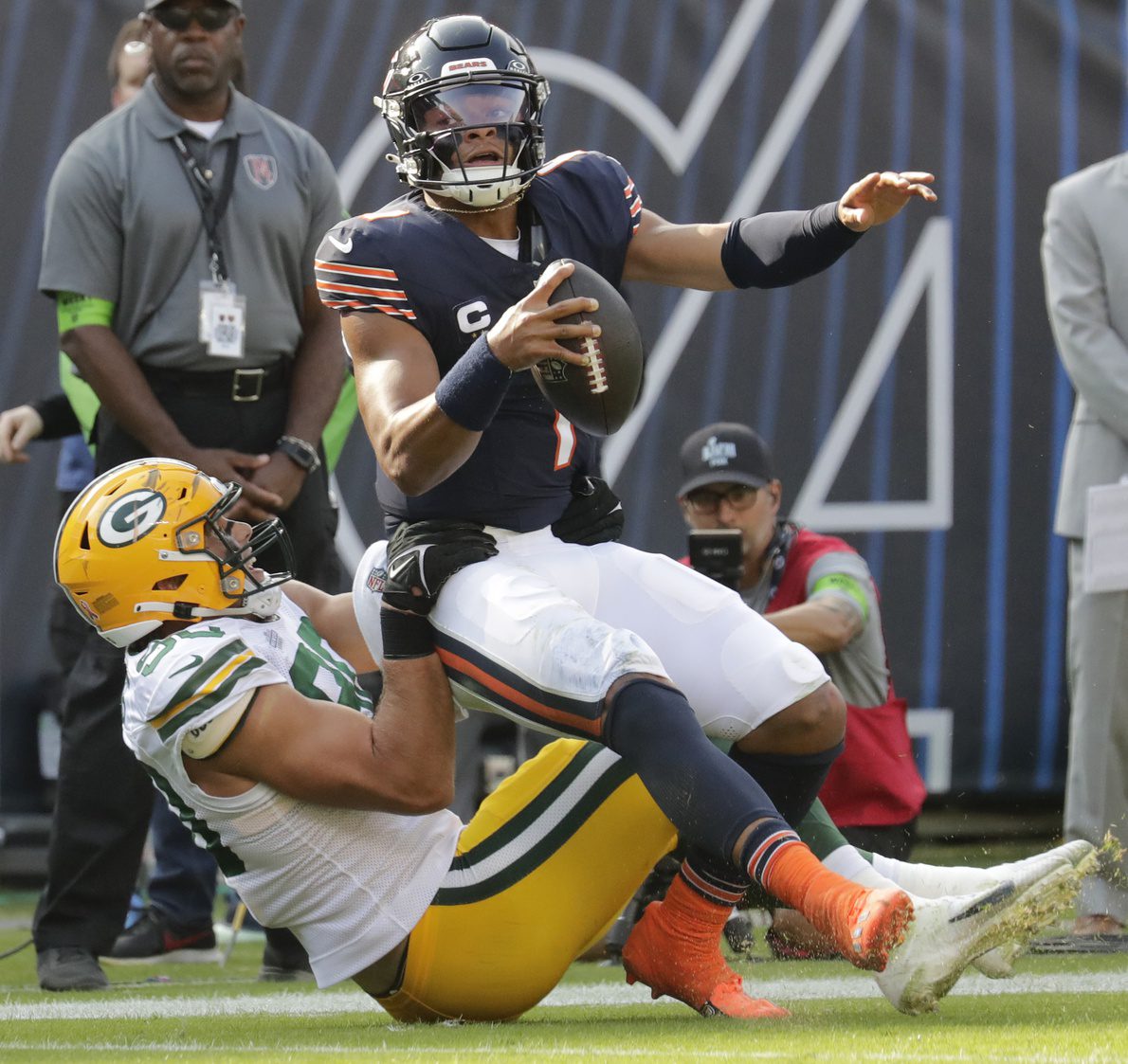 Sep 10, 2023; Chicago, Illinois, USA; Green Bay Packers linebacker Lukas Van Ness (90) tackles Chicago Bears quarterback Justin Fields (1) during their football game at Soldier Field. Mandatory Credit: Dan Powers-USA TODAY Sports Jets