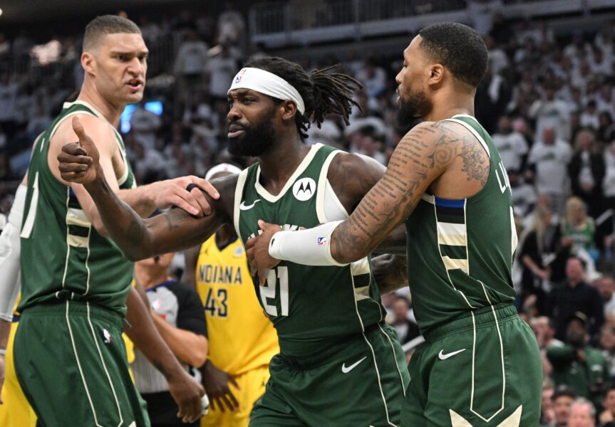 Apr 23, 2024; Milwaukee, Wisconsin, USA; Milwaukee Bucks guard Patrick Beverley (21) is held back by guard Damian Lillard (0) during a rebound against the Indiana Pacers in the second half during game two of the first round for the 2024 NBA playoffs at Fiserv Forum. Mandatory Credit: Michael McLoone-USA TODAY Sports