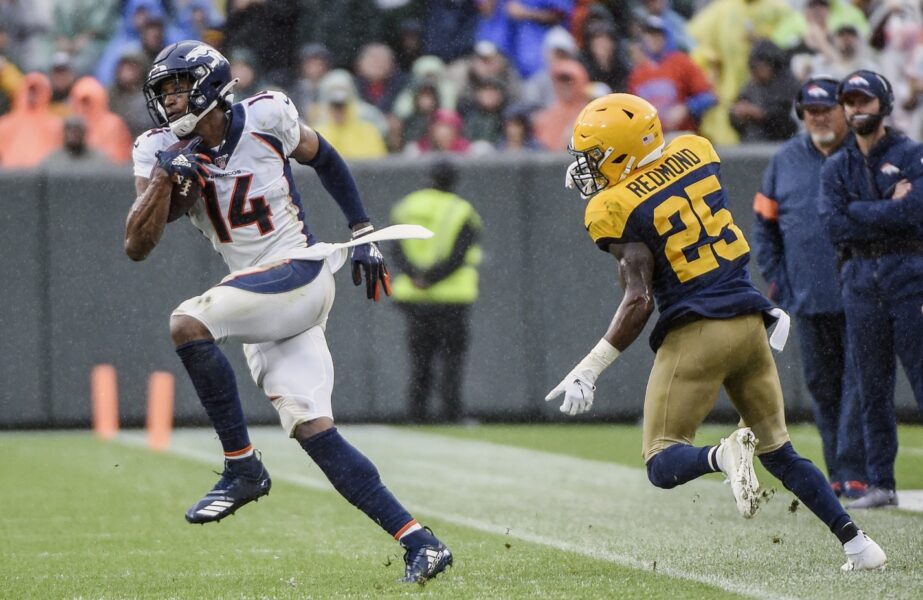 Sep 22, 2019; Green Bay, WI, USA; Denver Broncos wide receiver Courtland Sutton (14) eludes Green Bay Packers safety Will Redmond (25) after catching a pass in the third quarter at Lambeau Field. Mandatory Credit: Benny Sieu-USA TODAY Sports