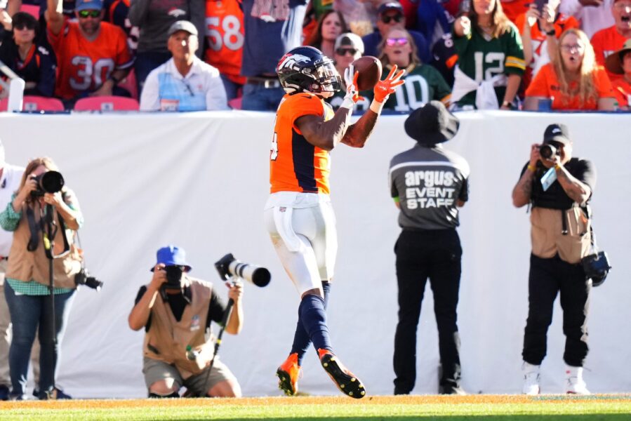 Oct 22, 2023; Denver, Colorado, USA; Denver Broncos wide receiver Courtland Sutton (14) pulls in a touchdown in the second half against the Green Bay Packers at Empower Field at Mile High. Mandatory Credit: Ron Chenoy-USA TODAY Sports