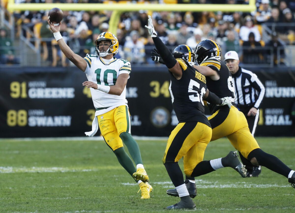 Nov 12, 2023; Pittsburgh, Pennsylvania, USA; Green Bay Packers quarterback Jordan Love (10) passes against pressure from Pittsburgh Steelers linebacker Elandon Roberts (50) and linebacker T.J. Watt (90) during the fourth quarter at Acrisure Stadium. Pittsburgh won 23-19. Mandatory Credit: Charles LeClaire-USA TODAY Sports