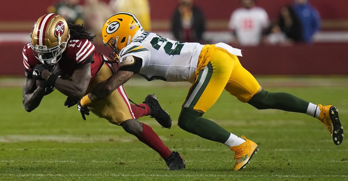 San Francisco 49ers wide receiver Brandon Aiyuk (11) makes an 11-yard reception before being tackled by Green Bay Packers cornerback Jaire Alexander (23) during the third quarter of their NFC divisional playoff game Saturday, January 20, 2024 at Levi’ Stadium in Santa Clara, California. The San Francisco 49ers beat the Green Bay Packers 24-21.