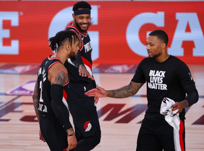 Aug 6, 2020; Lake Buena Vista, Florida, USA; Gary Trent Jr. #2 of the Portland Trail Blazers celebrates a three point basket against the Denver Nuggets with teammates Damian Lillard #0 of the Portland Trail Blazers and Carmelo Anthony #00 of the Portland Trail Blazers during the second quarter at Visa Athletic Center at ESPN Wide World Of Sports Complex on August 06, 2020 in Lake Buena Vista, Florida. Mandatory Credit: Kevin C. Cox/Pool Photo-USA TODAY Sports