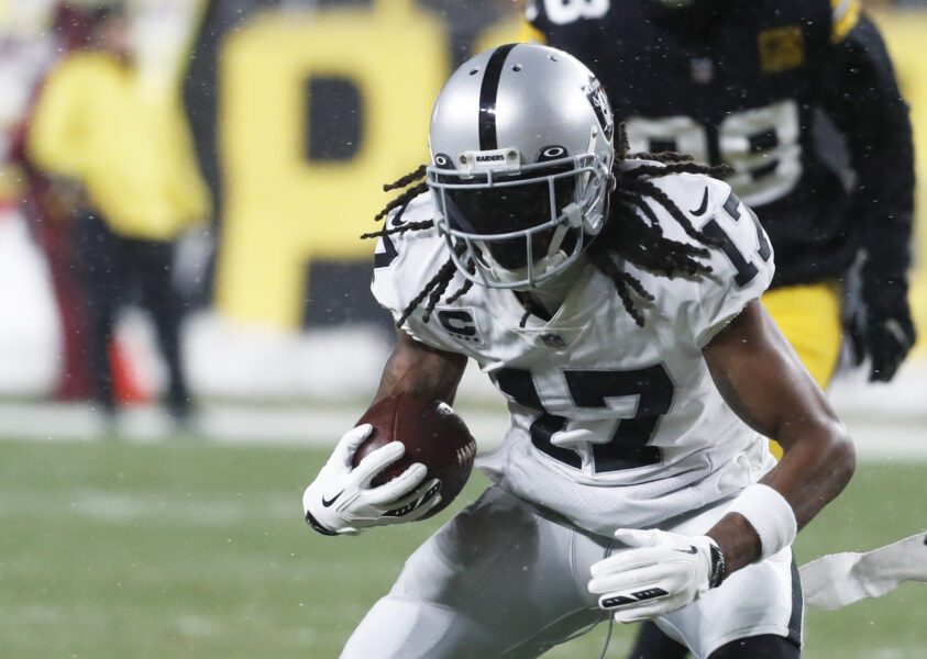 Dec 24, 2022; Pittsburgh, Pennsylvania, USA; Las Vegas Raiders wide receiver Davante Adams (17) runs after a catch against the Pittsburgh Steelers during the first quarter at Acrisure Stadium. Mandatory Credit: Charles LeClaire-USA TODAY Sports