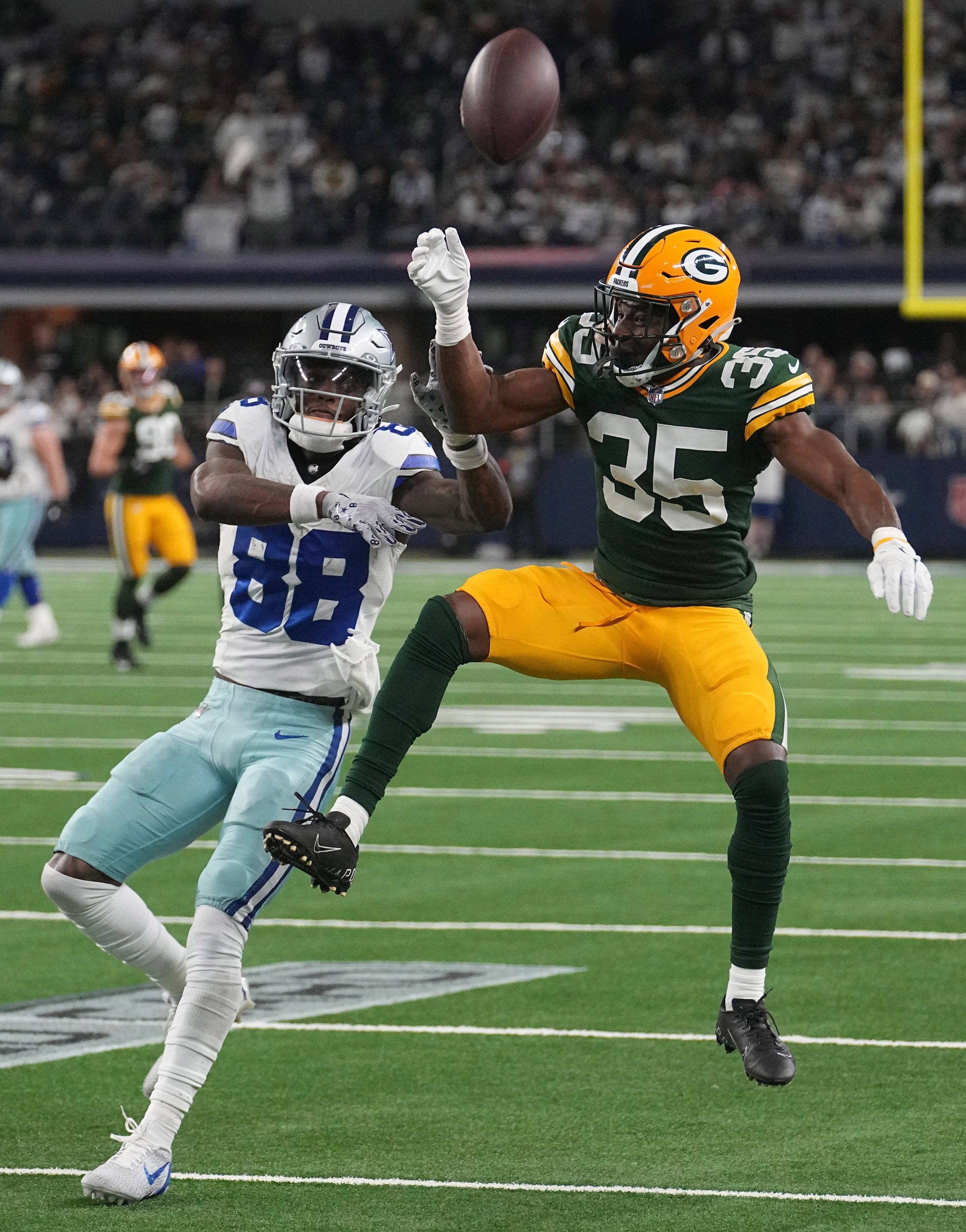 Jan 14, 2024; Arlington, Texas, USA; Dallas Cowboys wide receiver CeeDee Lamb (88) is unable to make a catch while being covered by Green Bay Packers cornerback Corey Ballentine (35) during the fourth quarter in a 2024 NFC wild card game at AT&T Stadium. Mandatory Credit: Mark Hoffman-USA TODAY Sports