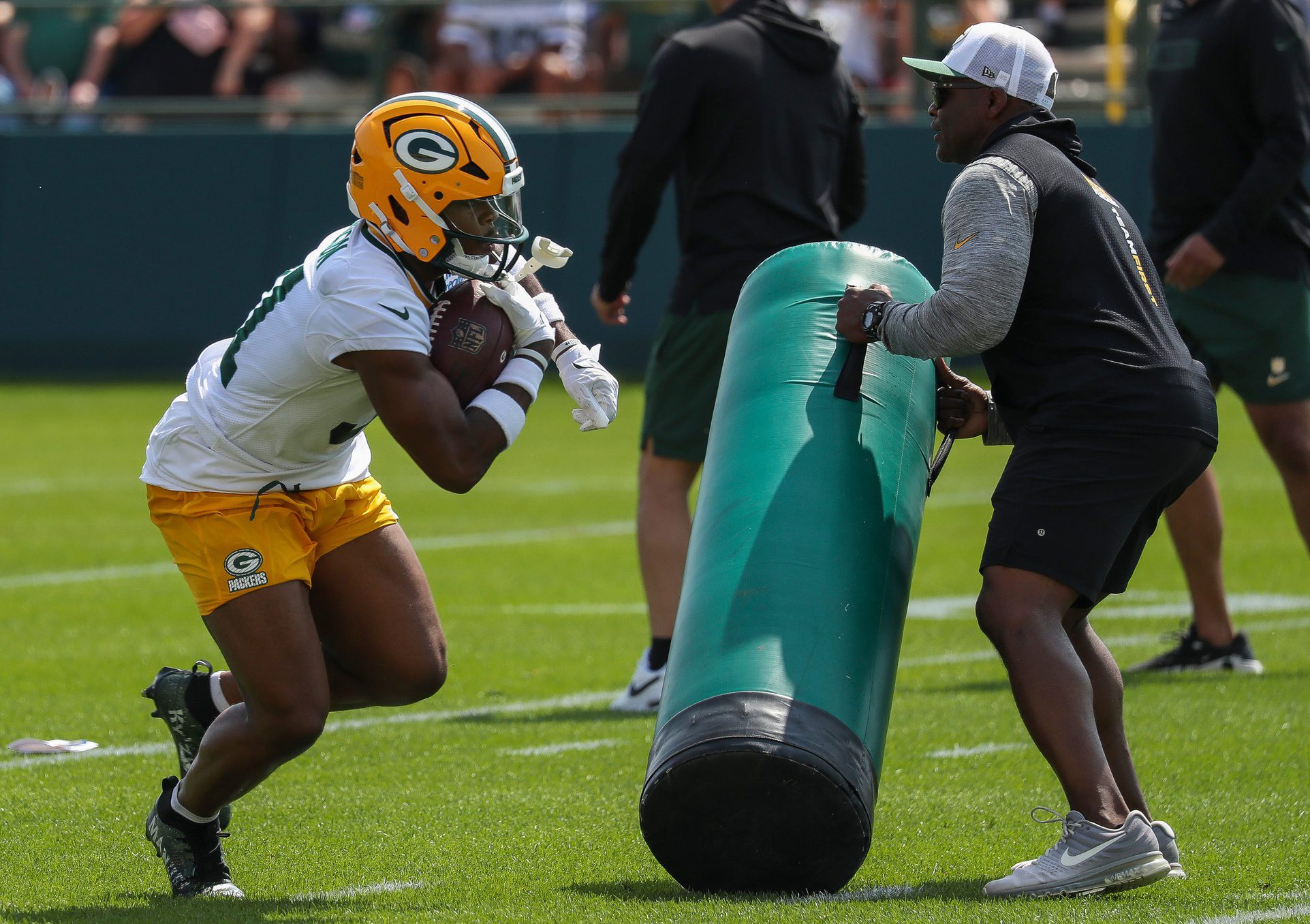 Green Bay Packers running back Emmanuel Wilson (31) runs through a drill during the first day of training camp on Monday, July 22, 2024, at in Green Bay, Wis. 