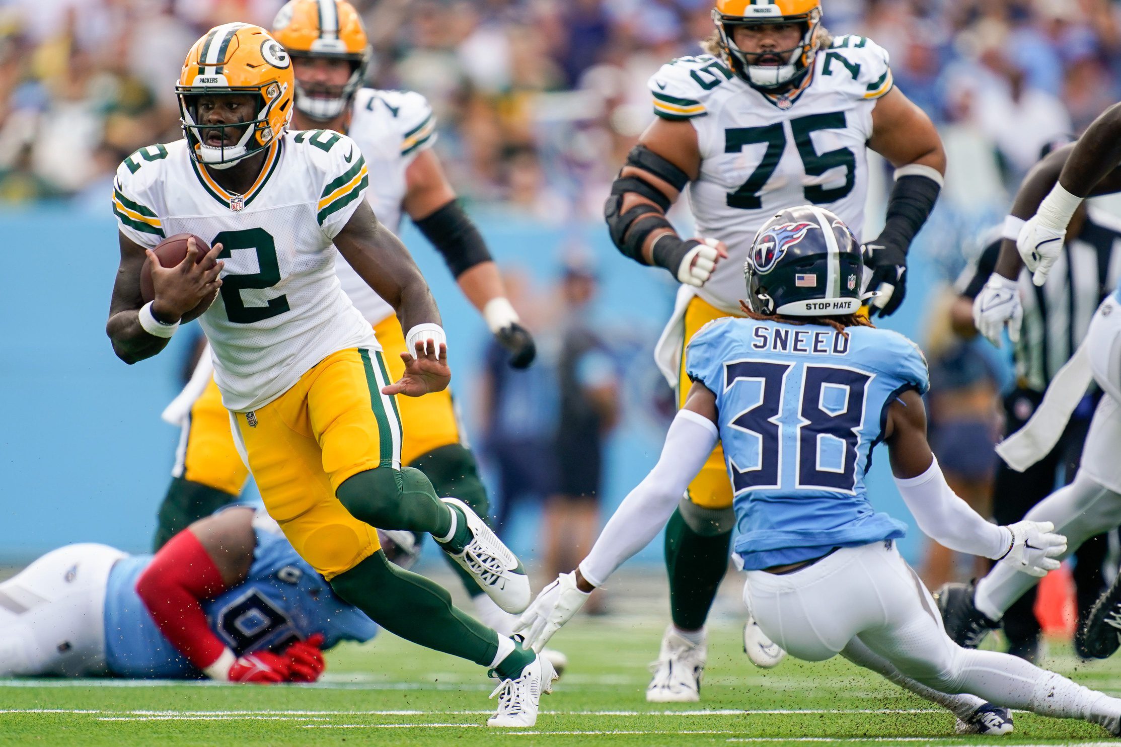 Green Bay Packers Malik WillisGreen Bay Packers quarterback Malik Willis (2) runs past Tennessee Titans cornerback L'Jarius Sneed (38) during the first quarter at Nissan Stadium in Nashville, Tenn., Sunday, Sept. 22, 2024.