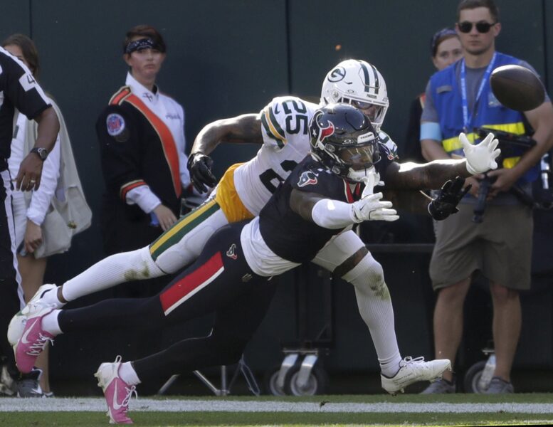 Oct 20, 2024; Green Bay, Wisconsin, USA; Green Bay Packers cornerback Keisean Nixon (25) breaks up a mpass to Houston Texans wide receiver Stefon Diggs (1) at Lambeau Field . Mandatory Credit: William Glasheen/Appleton Post-Crescent via the USA TODAY NETWORK-Wisconsin-Imagn Images