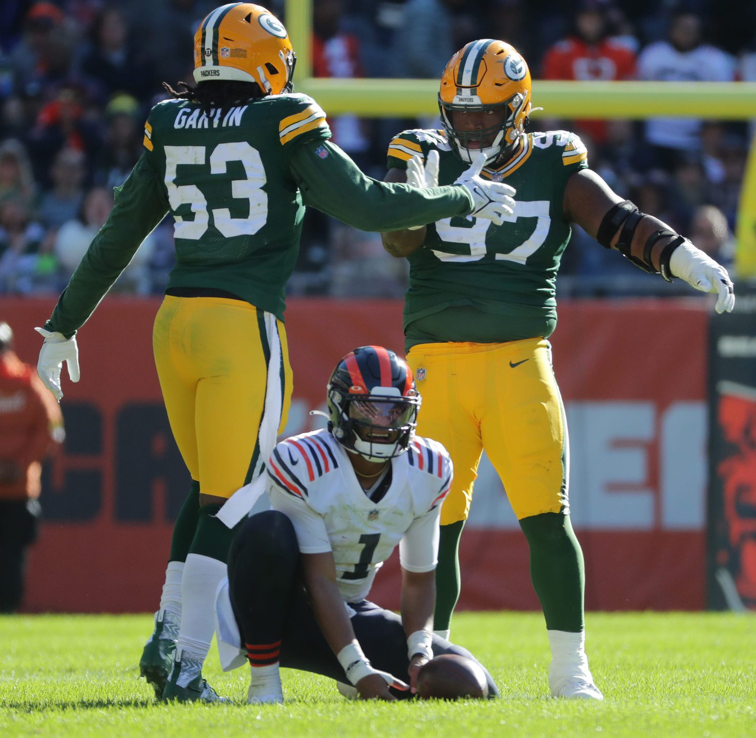 Green Bay Packers defensive tackle Kenny Clark (97) celebrates his key sack of Chicago Bears quarterback Justin Fields (1) on third down with Green Bay Packers linebacker Jonathan Garvin (53) late in the fourth quarter of their game Sunday, October 17m 2021 at Solider Field in Chicago, Ill. The Green Bay Packers beat the Chicago Bears 24-14. Jets