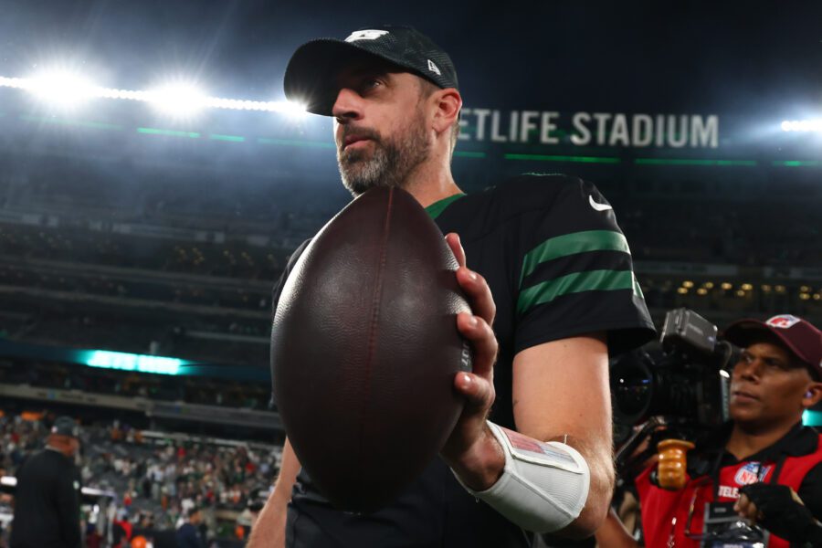 Oct 31, 2024; East Rutherford, New Jersey, USA; New York Jets wide receiver Davante Adams (17), quarterback Aaron Rodgers (8) and interim head coach Jeff Ulbrich celebrate Adams touchdown against the Houston Texans during the second half at MetLife Stadium. Mandatory Credit: Ed Mulholland-Imagn Images