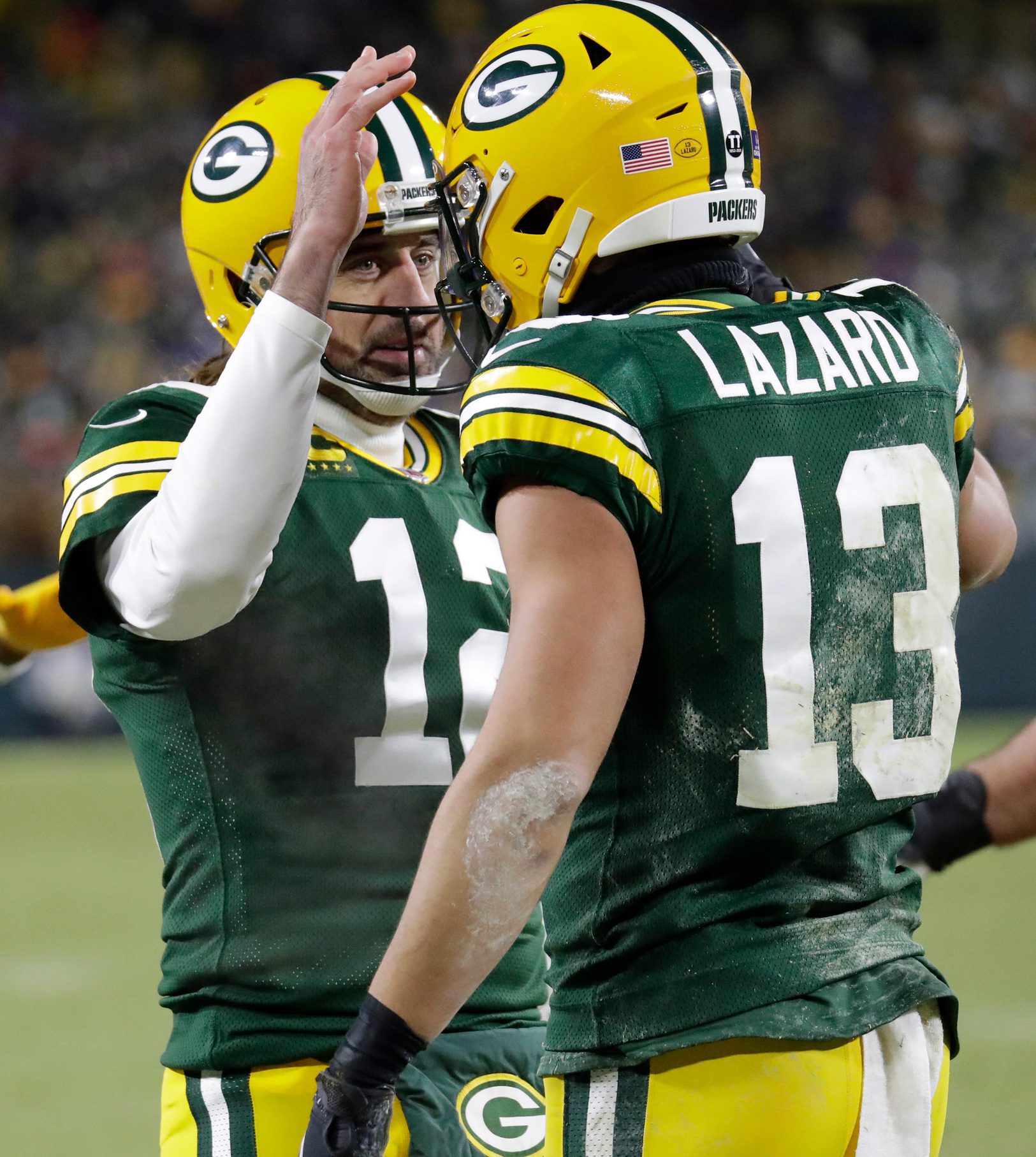 Green Bay Packers quarterback Aaron Rodgers (12) celebrates a touchdown pass to wide receiver Allen Lazard (13) against the Minnesota Vikings in the second quarter during their football game Sunday, January 2, 2022, at Lambeau Field in Green Bay, Wis. Dan Powers/USA TODAY NETWORK-Wisconsin