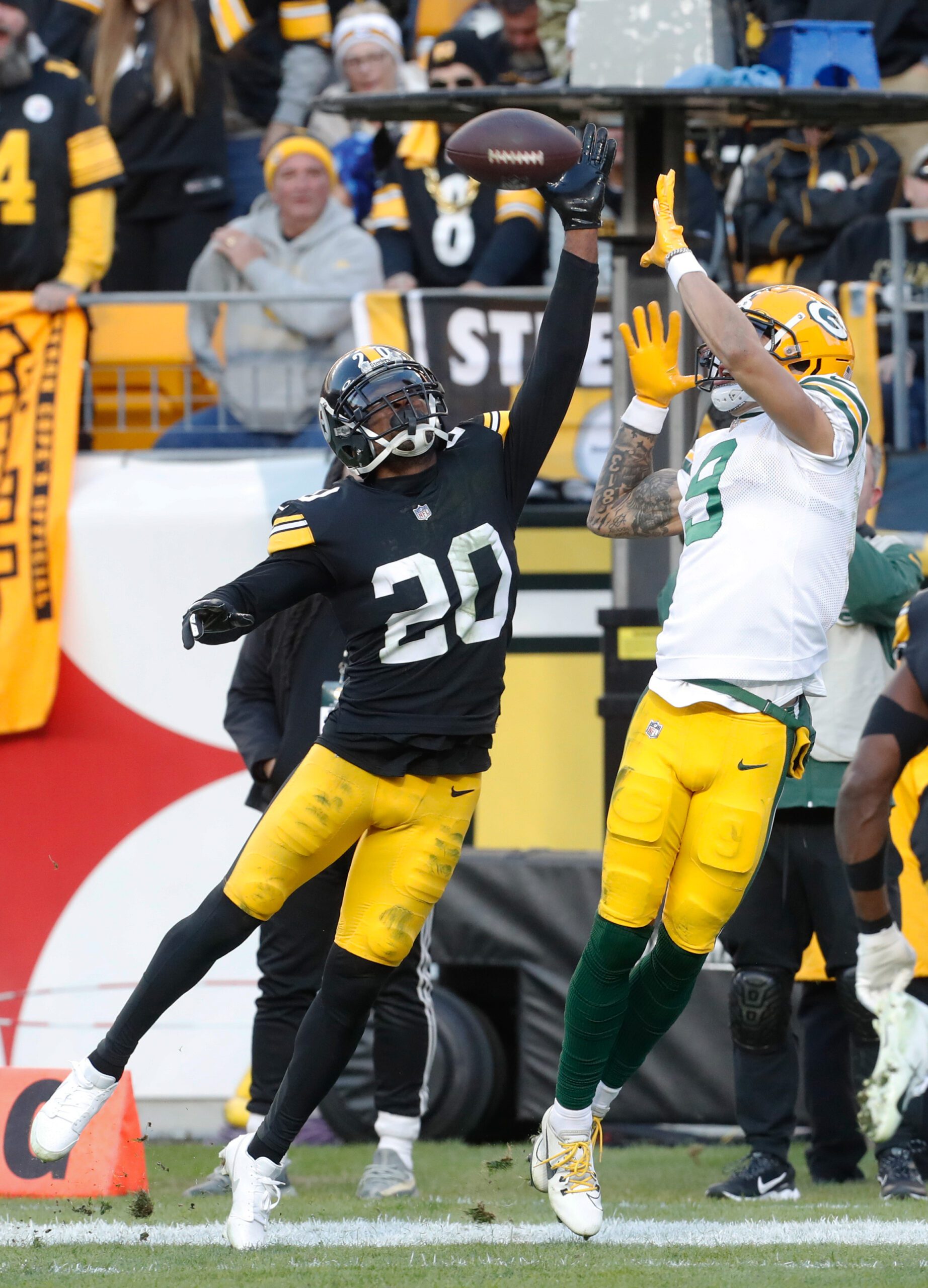 Nov 12, 2023; Pittsburgh, Pennsylvania, USA;  Pittsburgh Steelers cornerback Patrick Peterson (20) defends a pass intended for Green Bay Packers wide receiver Christian Watson (9) in the end-zone during the fourth quarter at Acrisure Stadium. Mandatory Credit: Charles LeClaire-USA TODAY Sports