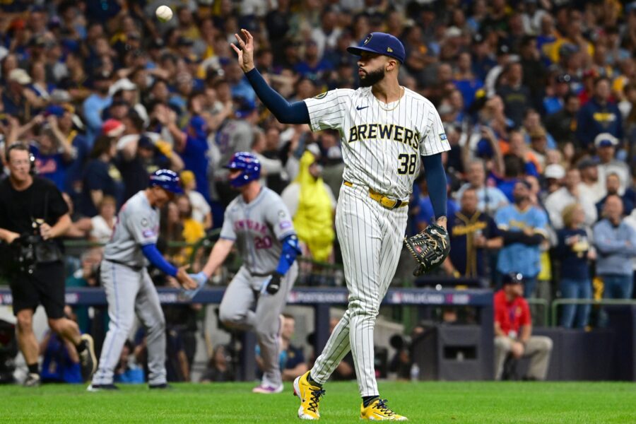 Milwaukee Brewers pitcher Devin Williams (38) and New York Mets first baseman Pete Alonso (20)