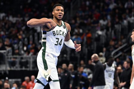 Dec 3, 2024; Detroit, Michigan, USA; Milwaukee Bucks forward Giannis Antetokounmpo (34) reacts after making a three-point shot against the Detroit Pistons in the third quarter at Little Caesars Arena. Mandatory Credit: Lon Horwedel-Imagn Images