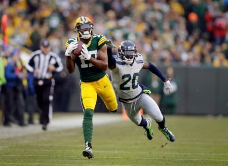 Green Bay Packers wide receiver Davante Adams (17) eludes Seattle Seahawks cornerback Jeremy Lane (20) for a 66 yard touchdown pass from Green Bay Packers quarterback Aaron Rodgers (12) in the first quarter during the Green Bay Packers and Seattle Seahawks NFL football game at Lambeau Field in Green Bay Wisconsin, Sunday, December 11, 2016. © Rick Wood / Milwaukee Journal Sentinel / USA TODAY NETWORK via Imagn Images