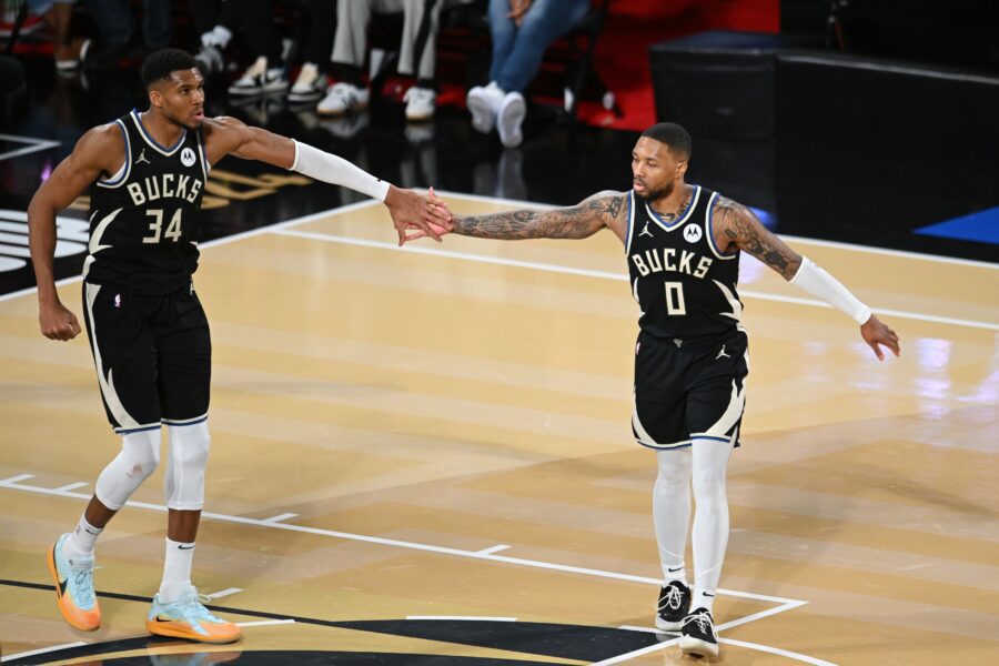 Dec 14, 2024; Las Vegas, Nevada, USA; Milwaukee Bucks guard Damian Lillard (0) and forward Giannis Antetokounmpo (34) react during the fourth quarter against the Atlanta Hawks in a semifinal of the 2024 Emirates NBA Cup at T-Mobile Arena. Mandatory Credit: Candice Ward-Imagn Images