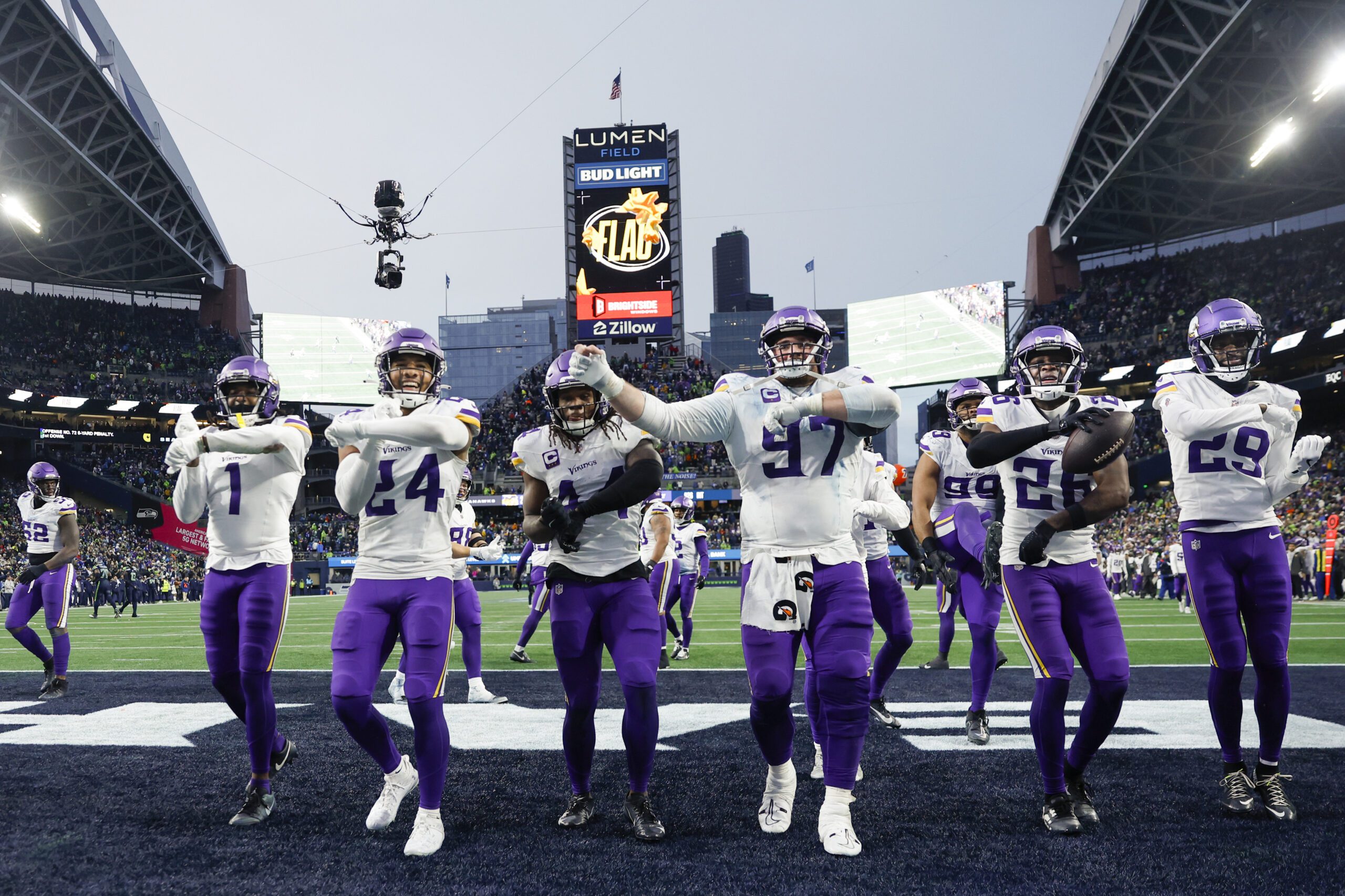 Dec 22, 2024; Seattle, Washington, USA; Minnesota Vikings safety Theo Jackson (26, second from right) leads a dance with cornerback Shaquill Griffin (1), safety Camryn Bynum (24), safety Josh Metellus (44), defensive tackle Harrison Phillips (97) and cornerback Dwight McGlothern (29) following his interception against the Seattle Seahawks during the fourth quarter at Lumen Field. Mandatory Credit: Joe Nicholson-Imagn Images Packers