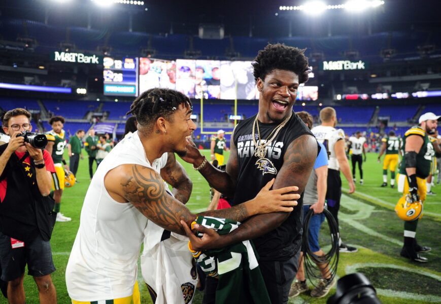 Aug 15, 2019; Baltimore, MD, USA; Baltimore Ravens quarterback Lamar Jackson (right) talks to Green Bay Packers cornerback Jaire Alexander (left) after the game at M&T Bank Stadium. Mandatory Credit: Evan Habeeb-Imagn Images