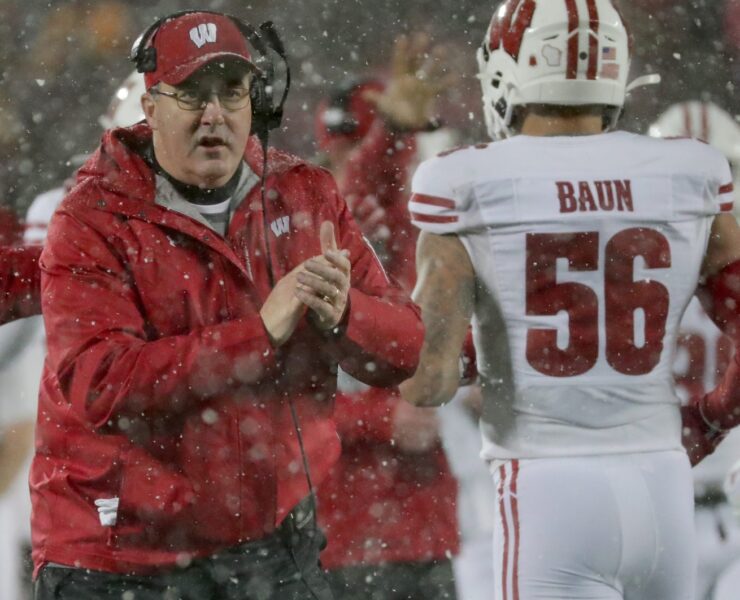 Wisconsin head coach Paul Chryst applauds