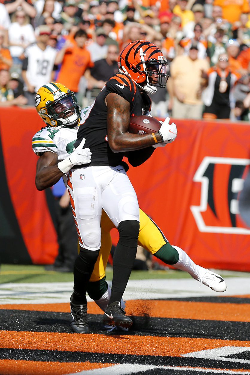 Oct 10, 2021; Cincinnati, Ohio, USA; Cincinnati Bengals wide receiver Tee Higgins (85)catches the two point conversion over Green Bay Packers cornerback Isaac Yiadom (24)during the fourth quarter at Paul Brown Stadium. Mandatory Credit: Joseph Maiorana-Imagn Images