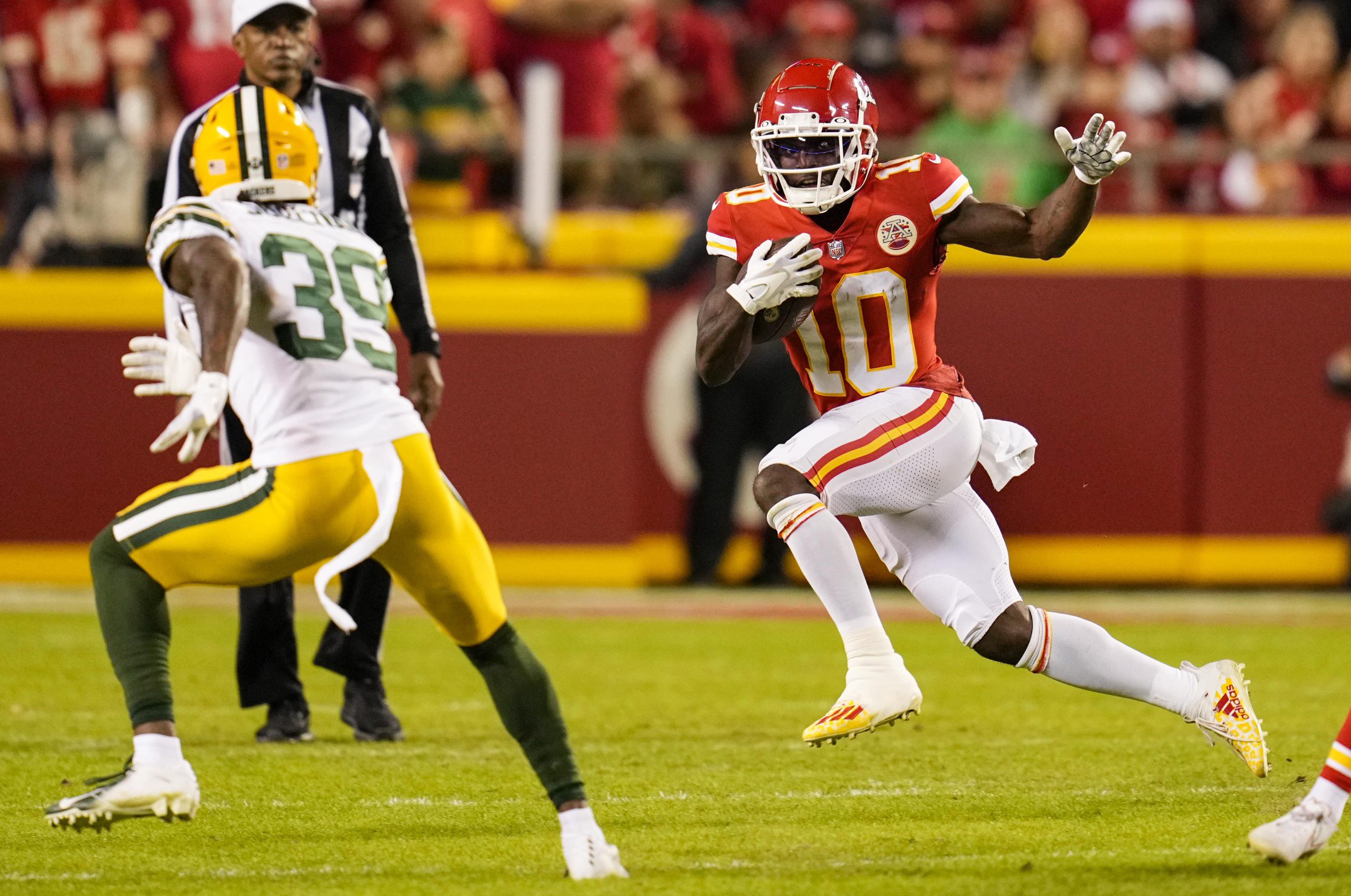 Nov 7, 2021; Kansas City, Missouri, USA; Kansas City Chiefs wide receiver Tyreek Hill (10) runs the ball against Green Bay Packers defensive back Chandon Sullivan (39) during the second half at GEHA Field at Arrowhead Stadium. Mandatory Credit: Jay Biggerstaff-Imagn Images