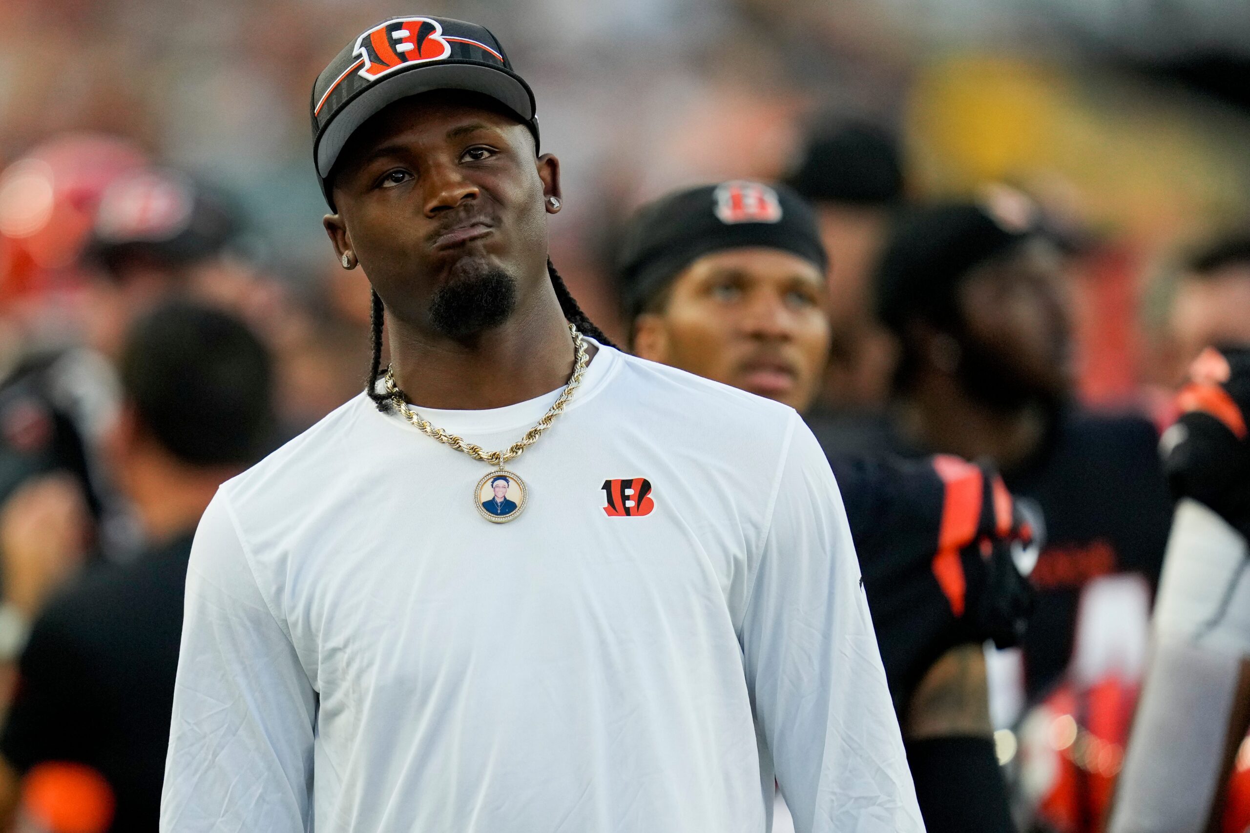 Cincinnati Bengals wide receiver Tee Higgins (5) watches the video board on the sideline in the second quarter of the NFL Preseason Week 1 game between the Cincinnati Bengals and the Green Bay Packers at Paycor Stadium in downtown Cincinnati on Friday, Aug. 11, 2023. The Packers led 21-16 at halftime.