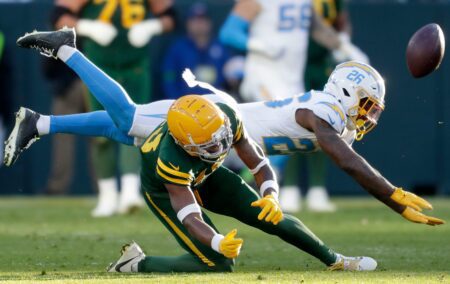 Los Angeles Chargers cornerback Asante Samuel Jr. (26) in called for pass interference on a throw to Green Bay Packers wide receiver Dontayvion Wicks (13) during their football game Sunday, November 19, 2023, at Lambeau Field in Green Bay, Wis. The Packers defeated the Chargers 23-20. Wm. Glasheen USA TODAY NETWORK-Wisconsin