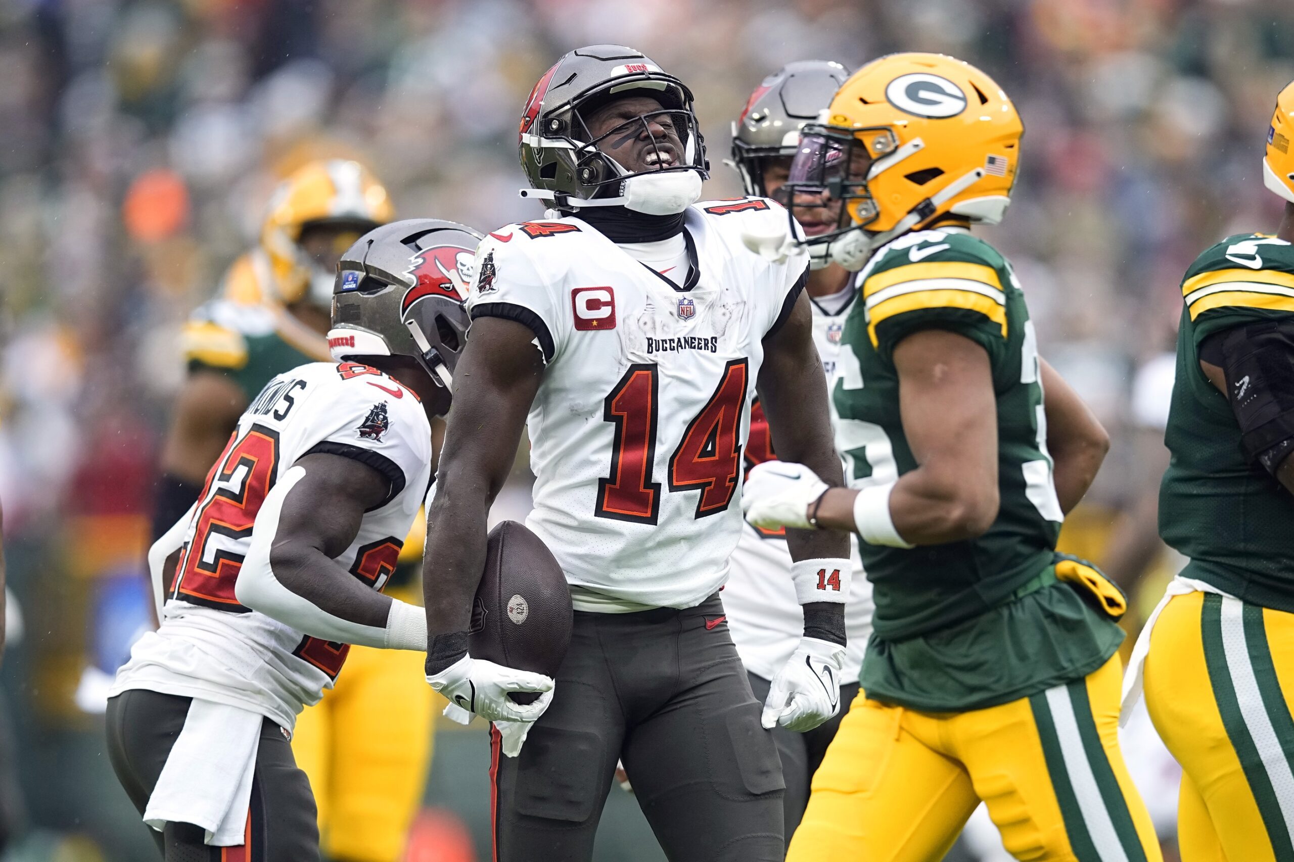 Dec 17, 2023; Green Bay, Wisconsin, USA; Tampa Bay Buccaneers wide receiver Chris Godwin (14) reacts after earning a first down during the first quarter against the Green Bay Packers at Lambeau Field. Mandatory Credit: Jeff Hanisch-Imagn Images