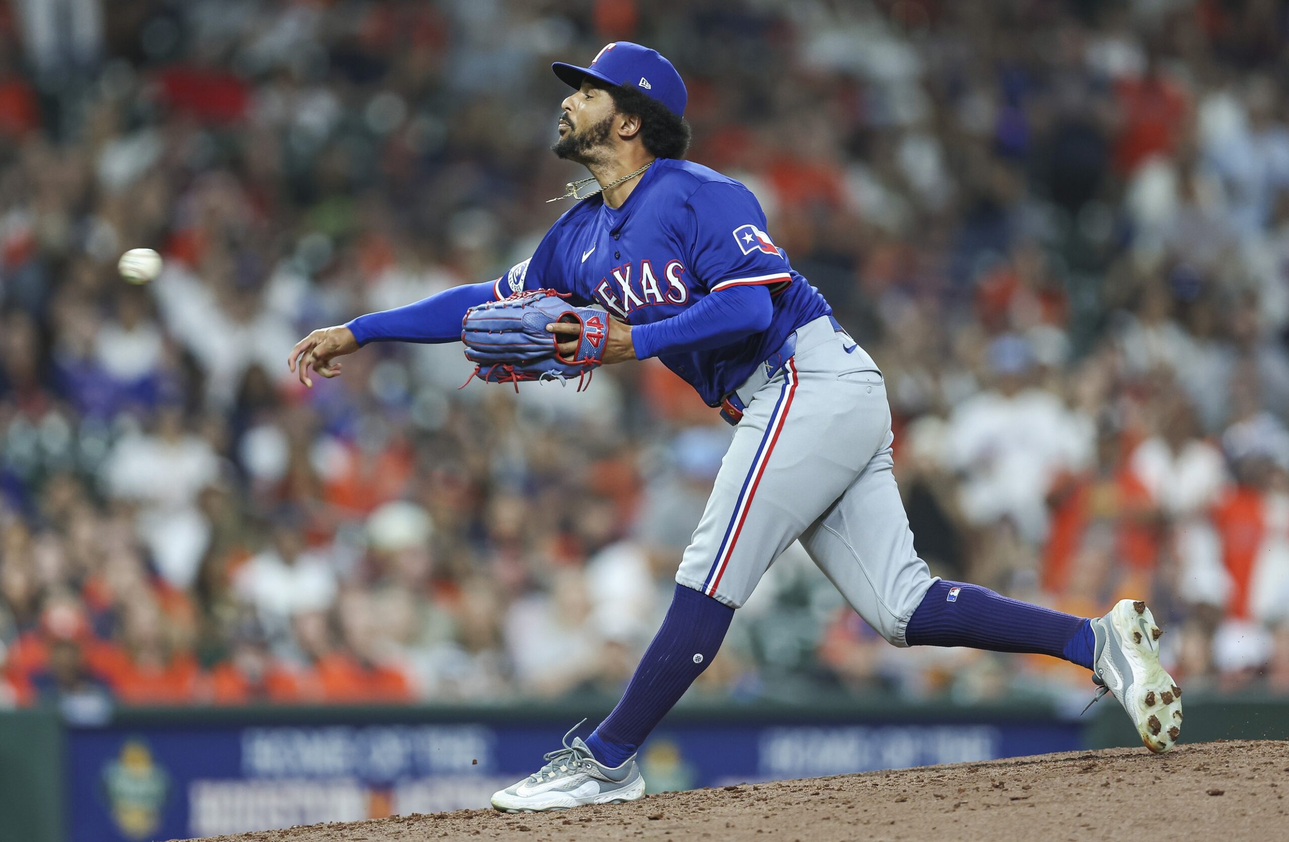 Apr 12, 2024; Houston, Texas, USA; Texas Rangers relief pitcher Grant Anderson (65) delivers a pitch during the seventh inning against the Houston Astros at Minute Maid Park. Mandatory Credit: Troy Taormina-Imagn Images