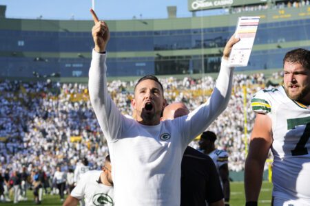 Oct 20, 2024; Green Bay, Wisconsin, USA; Green Bay Packers head coach Matt LaFleur celebrates while walking off the field following the game against the Houston Texans at Lambeau Field. Mandatory Credit: Jeff Hanisch-Imagn Images