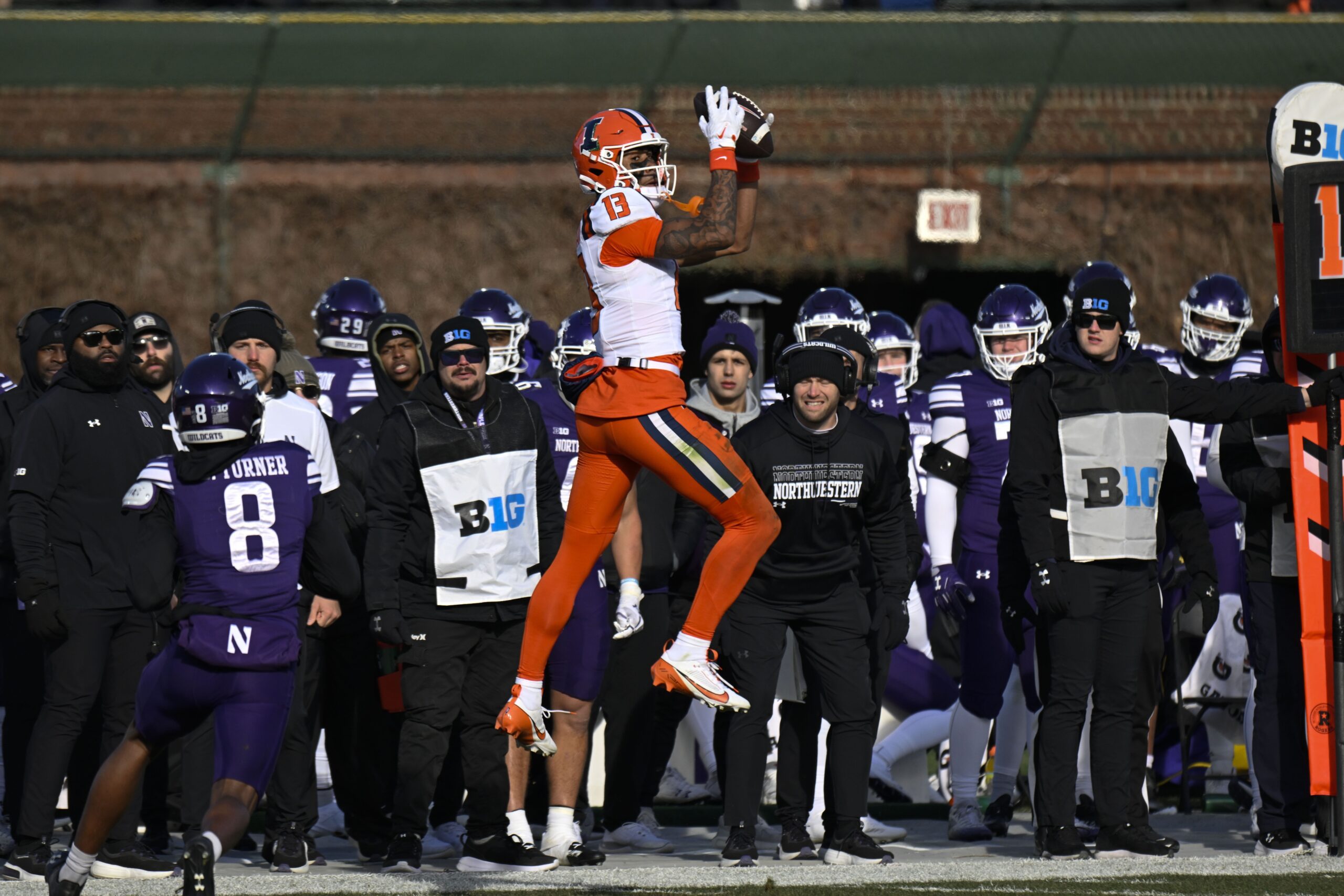 Nov 30, 2024; Chicago, Illinois, USA; Illinois Fighting Illini wide receiver Pat Bryant (13) catches a pass against Northwestern Wildcats during the second half at Wrigley Field. Mandatory Credit: Matt Marton-Imagn Images Packers