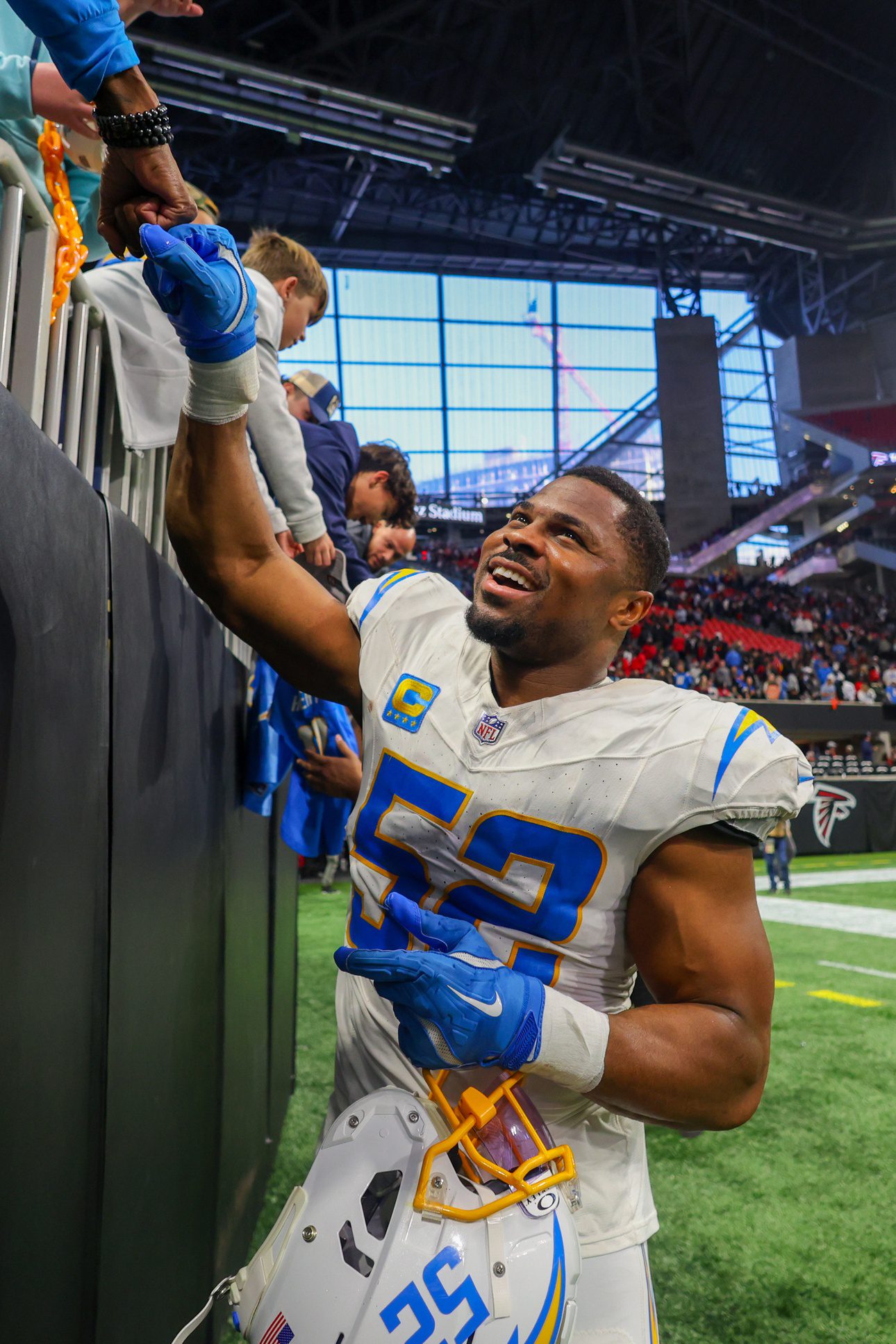 Dec 1, 2024; Atlanta, Georgia, USA; Los Angeles Chargers linebacker Khalil Mack (52) celebrates with fans after a victory over the Atlanta Falcons at Mercedes-Benz Stadium. Mandatory Credit: Brett Davis-Imagn Images Packers