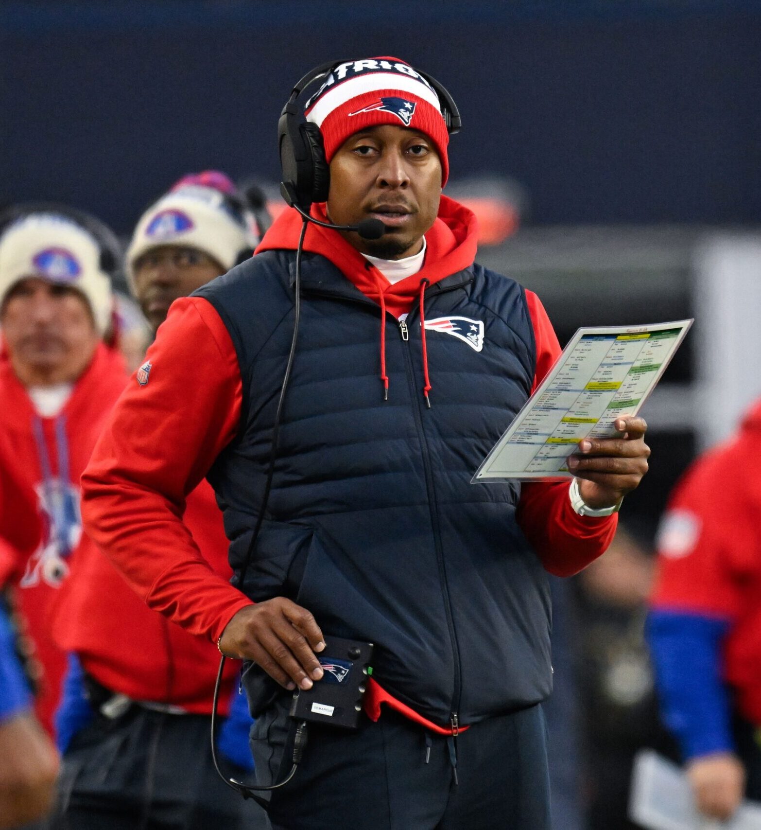 Dec 1, 2024; Foxborough, Massachusetts, USA; New England Patriots defensive coordinator Demarcus Covington works from the sideline during the second half against the Indianapolis Colts at Gillette Stadium. Mandatory Credit: Eric Canha-Imagn Images