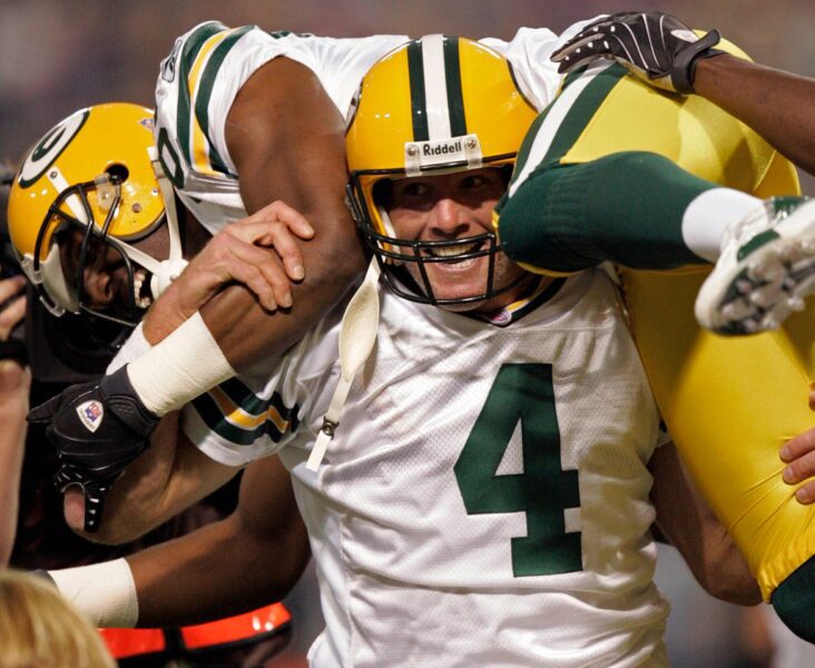 Green Bay Packers quarterback Brett Favre hoists its recipient