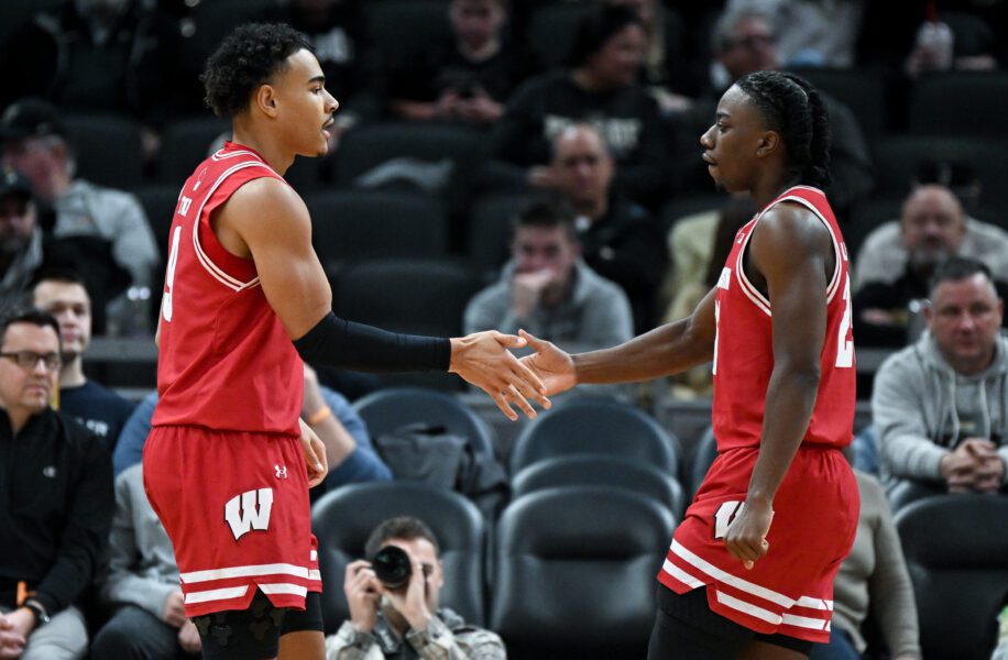 Wisconsin Badgers guard John Tonje (9) and guard John Blackwell (25) react