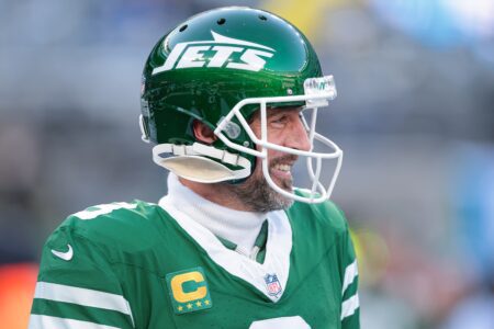 Dec 22, 2024; East Rutherford, New Jersey, USA; New York Jets quarterback Aaron Rodgers (8) looks on before the game against the Los Angeles Rams at MetLife Stadium. Mandatory Credit: Vincent Carchietta-Imagn Images