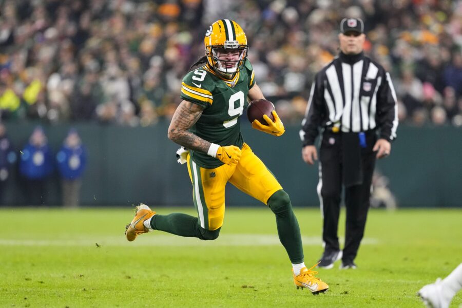 Dec 23, 2024; Green Bay, Wisconsin, USA; Green Bay Packers wide receiver Christian Watson (9) rushes with the football during the second quarter against the New Orleans Saints at Lambeau Field. Mandatory Credit: Jeff Hanisch-Imagn Images